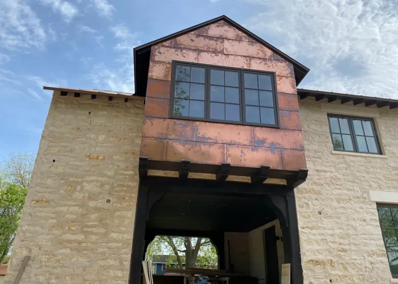 Copper metal panel facade on a stone building for Skylight Installation in Wawayanda